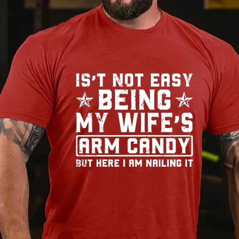 It's Not Easy Being My Wife's Arm Candy But Here I Am Nailing It Graphic T-Shirt