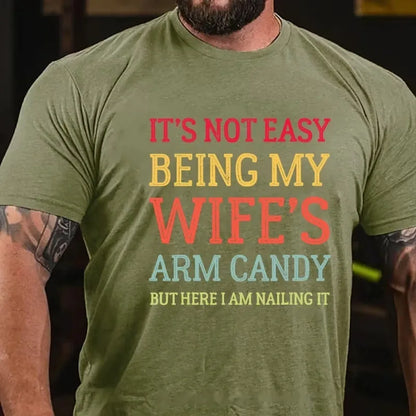 It's Not Easy Being My Wife's Arm Candy But Here I Am Nailing It Graphic T-Shirt