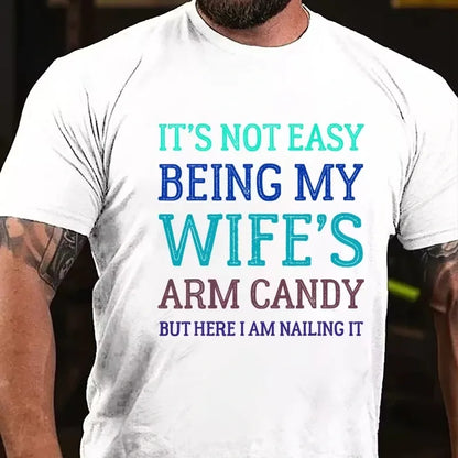 It's Not Easy Being My Wife's Arm Candy But Here I Am Nailing It Graphic T-Shirt