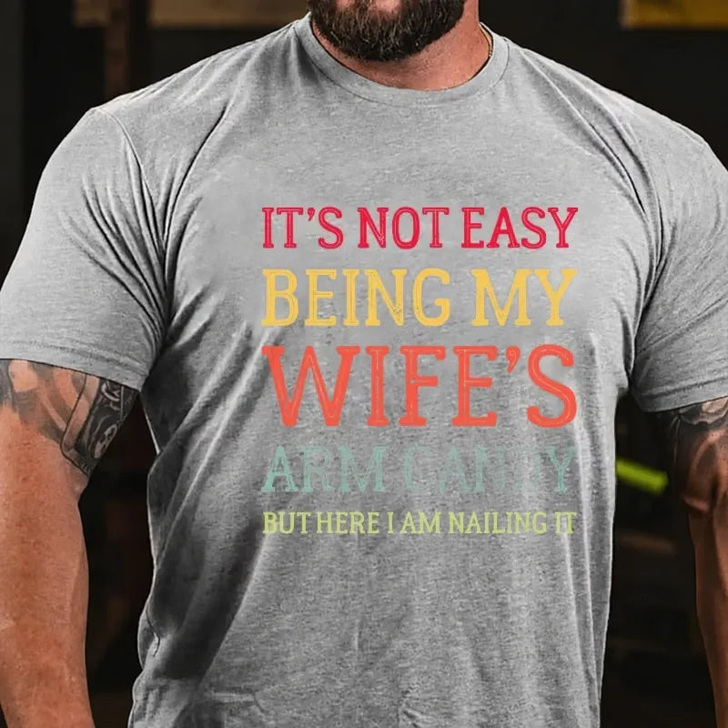 It's Not Easy Being My Wife's Arm Candy But Here I Am Nailing It Graphic T-Shirt
