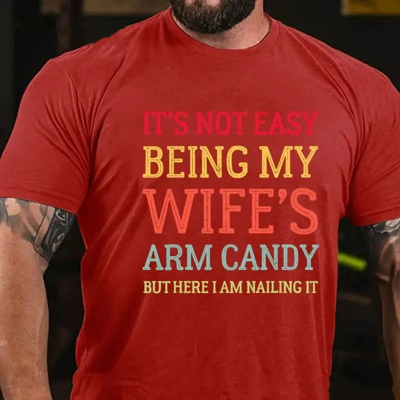 It's Not Easy Being My Wife's Arm Candy But Here I Am Nailing It Graphic T-Shirt