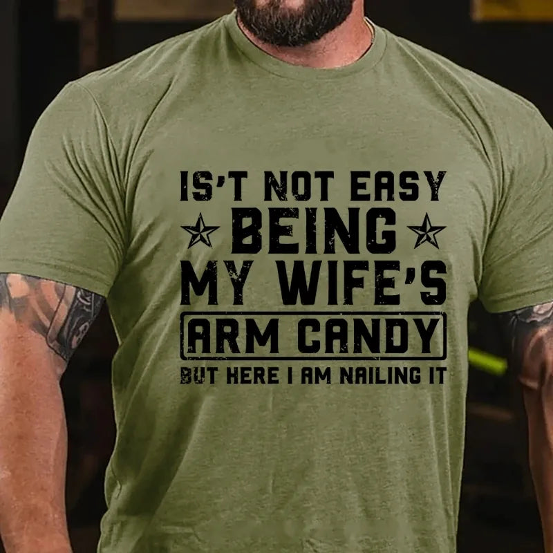 It's Not Easy Being My Wife's Arm Candy But Here I Am Nailing It Graphic T-Shirt